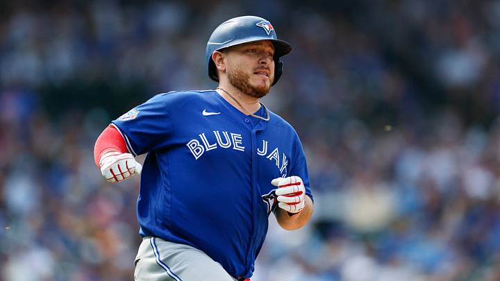 Aug 6, 2026; Chicago, Illinois, USA; Toronto Blue Jays catcher Alejandro Kirk (30) runs after hitting an RBI-single against the Chicago Cubs during the seventh inning at Wrigley Field. Mandatory Credit: Kamil Krzaczynski-Imagn Images