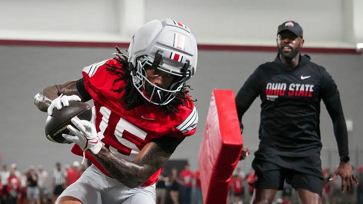 Ohio State Buckeyes wide receiver Chris Henry Jr. (15) catches a pass during football training camp inside the Woody Hayes Athletic Center in Columbus on Aug. 7, 2026. Ohio State Buckeyes wide receiver Chris Henry Jr. (15) catches a pass during football training camp inside the Woody Hayes Athletic Center in Columbus on Aug. 7, 2026.