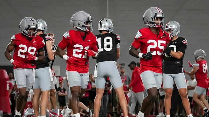 Ohio State Buckeyes running backs Bo Jackson (25), Turbo Rogers (21) and Favour Akih (29) run between drills during football training camp inside the Woody Hayes Athletic Center in Columbus on Aug. 7, 2026. Ohio State Buckeyes running backs Bo Jackson (25), Turbo Rogers (21) and Favour Akih (29) run between drills during football training camp inside the Woody Hayes Athletic Center in Columbus on Aug. 7, 2026.