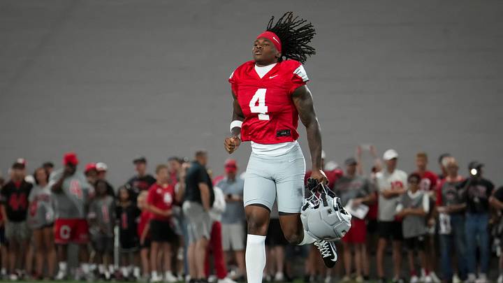 Ohio State Buckeyes wide receiver Jeremiah Smith (4) takes the field for football training camp inside the Woody Hayes Athletic Center in Columbus on Aug. 7, 2026. Ohio State Buckeyes wide receiver Jeremiah Smith (4) takes the field for football training camp inside the Woody Hayes Athletic Center in Columbus on Aug. 7, 2026.