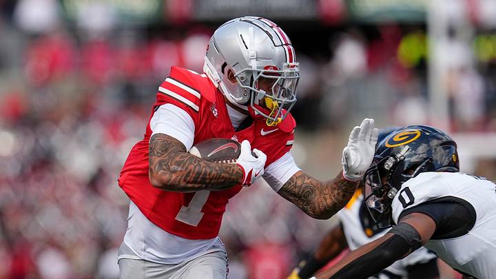 Ohio State Buckeyes wide receiver Brandon Inniss (1) runs past Grambling State Tigers defensive back Quintin Talley (0) during the NCAA football game at Ohio Stadium on Sept. 6, 2025. Ohio State Buckeyes wide receiver Brandon Inniss (1) runs past Grambling State Tigers defensive back Quintin Talley (0) during the NCAA football game at Ohio Stadium on Sept. 6, 2025.
