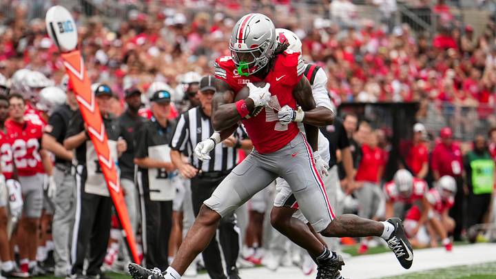 Ohio State Buckeyes wide receiver Jeremiah Smith (4) catches a pass in front of Ball State Cardinals defensive back Willizhuan Yates (4) during the NCAA football game at Ohio Stadium in Columbus on Sept. 5, 2026. Ohio State Buckeyes wide receiver Jeremiah Smith (4) catches a pass in front of Ball State Cardinals defensive back Willizhuan Yates (4) during the NCAA football game at Ohio Stadium in Columbus on Sept. 5, 2026.