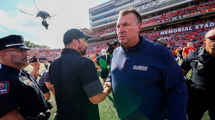 Ohio State Buckeyes head coach Ryan Day shakes hands with Illinois Fighting Illini head coach Bret Bielema following the Buckeyes' 34-16 win in the NCAA football game at Gies Memorial Stadium in Champaign on Oct. 11, 2025. Ohio State Buckeyes head coach Ryan Day shakes hands with Illinois Fighting Illini head coach Bret Bielema following the Buckeyes' 34-16 win in the NCAA football game at Gies Memorial Stadium in Champaign on Oct. 11, 2025.