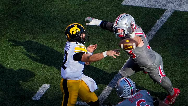 Oct 5, 2024; Columbus, Ohio, USA; Ohio State Buckeyes defensive end Jack Sawyer (33) and safety Sonny Styles (6) approach Iowa Hawkeyes quarterback Cade McNamara (12) in the second quarter at Ohio Stadium on Saturday.