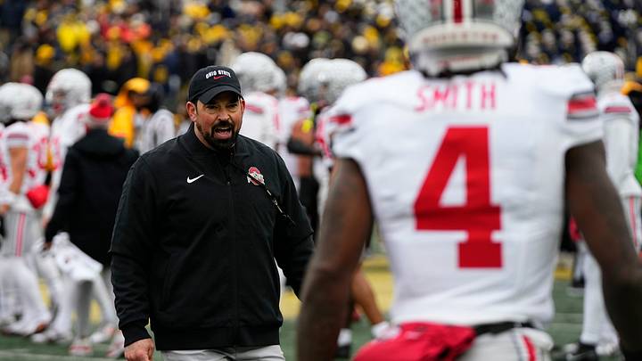 Ohio State Buckeyes head coach Ryan Day yells to wide receiver Jeremiah Smith (4) prior to the NCAA football game against the Michigan Wolverines at Michigan Stadium in Ann Arbor, Mich. on Nov. 29, 2025. Ohio State Buckeyes head coach Ryan Day yells to wide receiver Jeremiah Smith (4) prior to the NCAA football game against the Michigan Wolverines at Michigan Stadium in Ann Arbor, Mich. on Nov. 29, 2025.