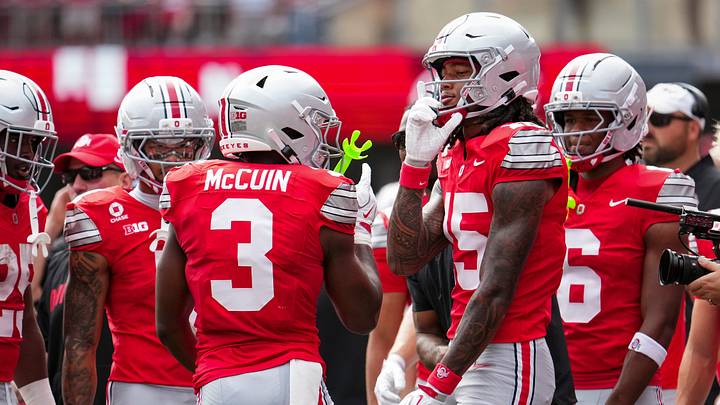 Ohio State Buckeyes wide receiver Devin McCuin (3) celebrates a touchdown with wide receiver Chris Henry Jr. (15) during the NCAA football game against the Ball State Cardinals at Ohio Stadium in Columbus on Sept. 5, 2026.