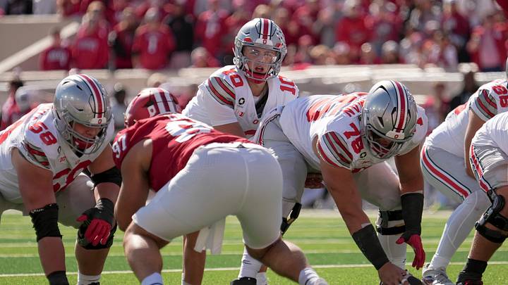 Ohio State Buckeyes quarterback Julian Sayin (10) takes a snap from o75o#2 during the NCAA football game at Memorial Stadium Stadium in Bloomington, Ind. on Oct. 17, 2026. Ohio State Buckeyes quarterback Julian Sayin (10) takes a snap from o75o#2 during the NCAA football game at Memorial Stadium Stadium in Bloomington, Ind. on Oct. 17, 2026.