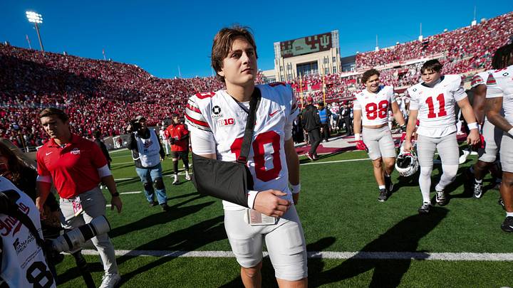 Ohio State Buckeyes quarterback Julian Sayin (10) leaves the field in a sling following the 19-15 win over the Indiana Hoosiers in the NCAA football game at Memorial Stadium Stadium in Bloomington, Ind. on Oct. 17, 2026.