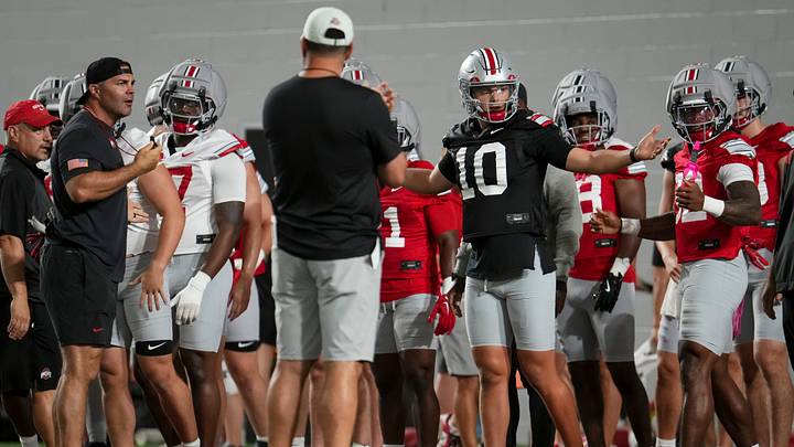 Ohio State Buckeyes quarterback Julian Sayin (10) lines up his teammates for stretching during football training camp inside the Woody Hayes Athletic Center in Columbus on Aug. 7, 2026. Ohio State Buckeyes quarterback Julian Sayin (10) lines up his teammates for stretching during football training camp inside the Woody Hayes Athletic Center in Columbus on Aug. 7, 2026.