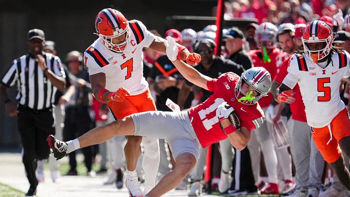 Ohio State Buckeyes wide receiver Brock Boyd (11) is knocked out of bounds by Illinois Fighting Illini defensive back Matthew Bailey (7) during the NCAA football game at Ohio Stadium in Columbus on Sept. 26, 2026. Ohio State Buckeyes wide receiver Brock Boyd (11) is knocked out of bounds by Illinois Fighting Illini defensive back Matthew Bailey (7) during the NCAA football game at Ohio Stadium in Columbus on Sept. 26, 2026.