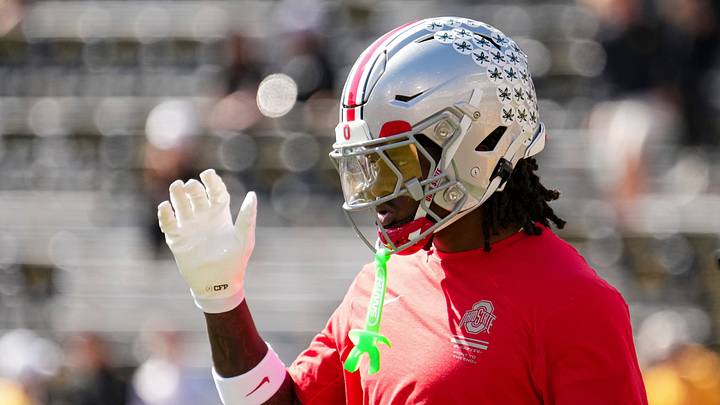 Ohio State Buckeyes wide receiver Jeremiah Smith (4) warms up during the NCAA football game against the Iowa Hawkeyes at Kinnick Stadium in Iowa City on Oct. 3, 2026. Ohio State Buckeyes wide receiver Jeremiah Smith (4) warms up during the NCAA football game against the Iowa Hawkeyes at Kinnick Stadium in Iowa City on Oct. 3, 2026.