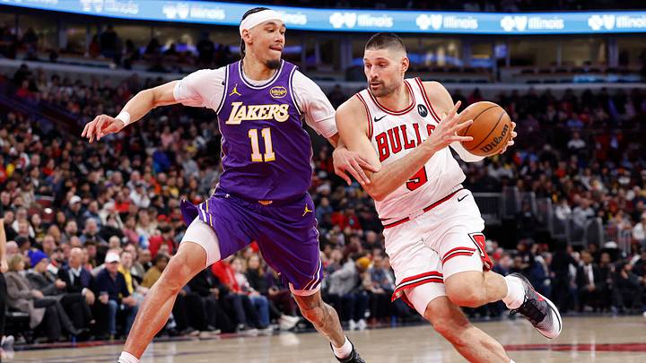 Jan 26, 2026; Chicago, Illinois, USA; Chicago Bulls center Nikola Vucevic (9) drives to the basket against Los Angeles Lakers center Jaxson Hayes (11) during the first half at United Center. Mandatory Credit: Kamil Krzaczynski-Imagn Images