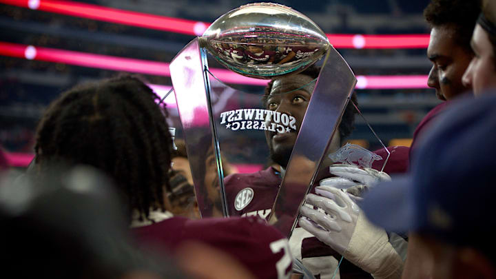 Sep 28, 2024; Arlington, Texas, USA; The Texas A&M Aggies hoist the Southwest Classic trophy after beating the Arkansas Razorbacks for the final time at AT&T Stadium.