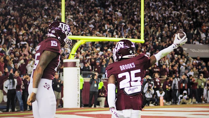 Nov 30, 2024, College Station, Texas, USA; Texas A&M Aggies defensive back Dalton Brooks (25) celebrates with defensive lineman Rylan Kennedy (15) after blocking a punt against the Texas Longhorns at Kyle Field during the Lone Star Showdown.