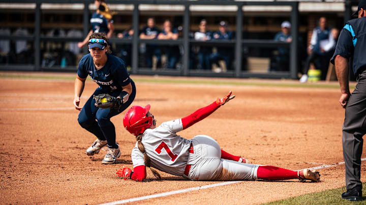 Nebraska shortstop Ava Kuszak slides safely into third base against Penn State during the Big Ten Tournament quarterfinals in West Lafayette. Nebraska shortstop Ava Kuszak slides safely into third base against Penn State during the Big Ten Tournament quarterfinals in West Lafayette.