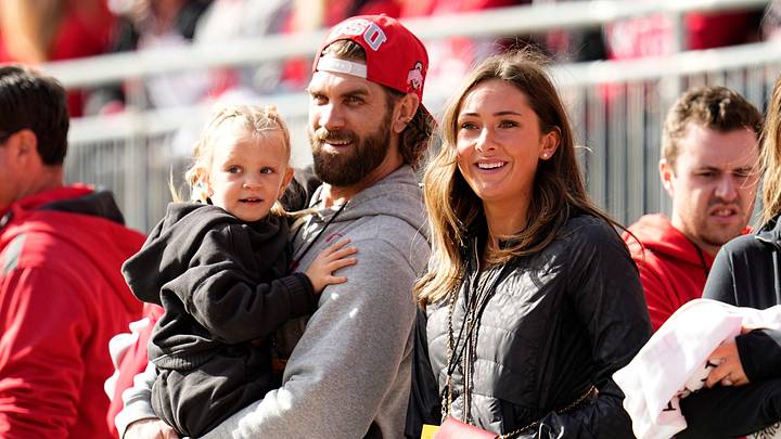 Bryce Harper and his wife, Ohio State alum Kayla Harper, watch on the sideline during the first half of the NCAA football game between the Ohio State Buckeyes and the Nebraska Cornhuskers at Ohio Stadium in Columbus on Saturday, Oct. 26, 2024. Bryce Harper and his wife, Ohio State alum Kayla Harper, watch on the sideline during the first half of the NCAA football game between the Ohio State Buckeyes and the Nebraska Cornhuskers at Ohio Stadium in Columbus on Saturday, Oct. 26, 2024.