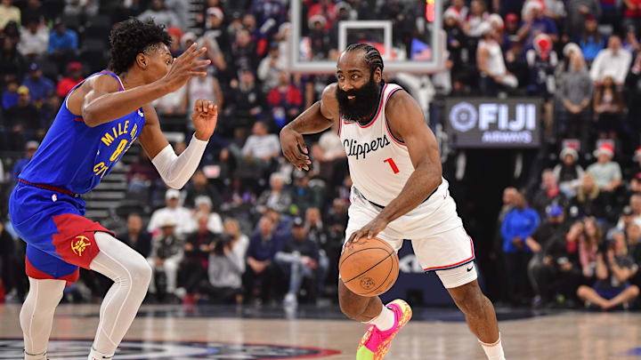 Dec 1, 2024; Inglewood, California, USA; Los Angeles Clippers guard James Harden (1) moves to the basket against Denver Nuggets forward Peyton Watson (8) during the first half at Intuit Dome. Mandatory Credit: Gary A. Vasquez-Imagn Images