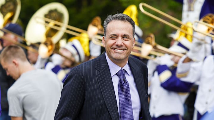 Oct 5, 2024; Seattle, Washington, USA; Washington Huskies head coach Jedd Fisch walks into Alaska Airlines Field at Husky Stadium before a game against the Michigan Wolverines. Mandatory Credit: Joe Nicholson-Imagn Images