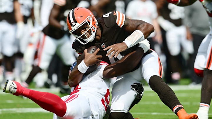 Sep 22, 2024; Cleveland, Ohio, USA; New York Giants defensive tackle Elijah Chatman (94) sacks Cleveland Browns quarterback Deshaun Watson (4) during the first quarter at Huntington Bank Field. Mandatory Credit: Ken Blaze-Imagn Images Sep 22, 2024; Cleveland, Ohio, USA; New York Giants defensive tackle Elijah Chatman (94) sacks Cleveland Browns quarterback Deshaun Watson (4) during the first quarter at Huntington Bank Field. Mandatory Credit: Ken Blaze-Imagn Images