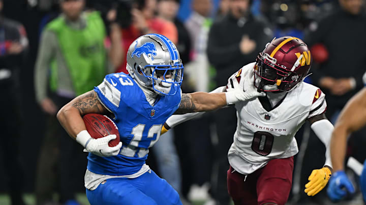 Washington Commanders corner back Mike Sainristil tackles Detroit Lions running back Craig Reynolds.