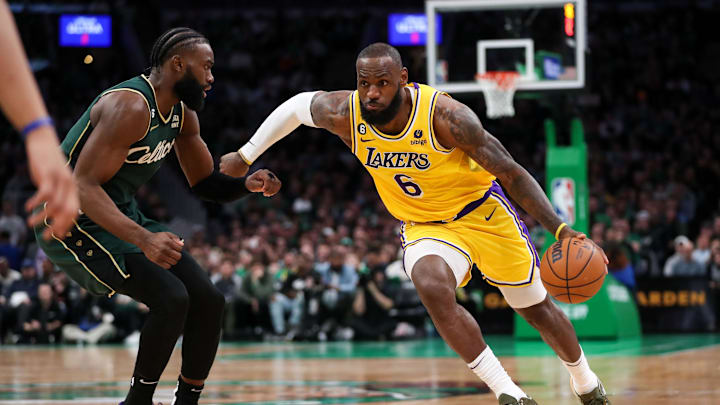 Jan 28, 2023; Boston, Massachusetts, USA; Los Angeles Lakers forward LeBron James (6) drives to the basket defended by Boston Celtics forward Jaylen Brown (7) during the second half at TD Garden. Mandatory Credit: Paul Rutherford-Imagn Images