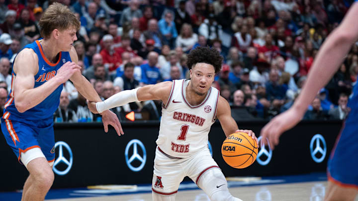 Alabama Crimson Tide guard Mark Sears (1) drives the paint against Florida Gators forward Thomas Haugh (10) during their SEC Men's Basketball Tournament quarterfinal game at Bridgestone Arena in Nashville, Tenn., Friday, March 15, 2024.at Bridgestone Arena in Nashville, Tenn., Friday, March 15, 2024.