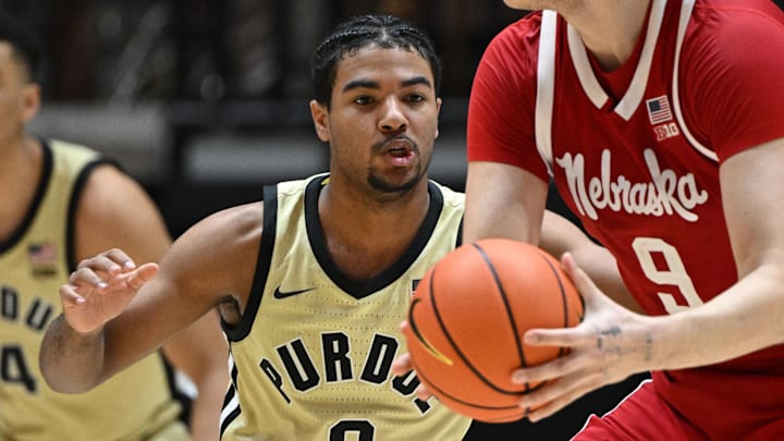 Purdue Boilermakers guard C.J. Cox (0) looks at a ball controlled by Nebraska Cornhuskers forward Berke Buyuktuncel (9).