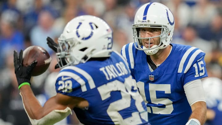 Indianapolis Colts quarterback Joe Flacco (15) tosses the ball to Indianapolis Colts running back Jonathan Taylor (28) on Sunday, Sept. 29, 2024, during a game against the Pittsburgh Steelers at Lucas Oil Stadium in Indianapolis.