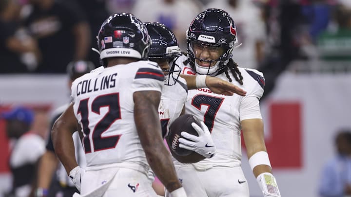 Sep 15, 2025; Houston, Texas, USA; Houston Texans quarterback C.J. Stroud (7) celebrates with running back Nick Chubb (21) after Chubb scores a touchdown during the fourth quarter against the Tampa Bay Buccaneers at NRG Stadium. Mandatory Credit: Troy Taormina-Imagn Images