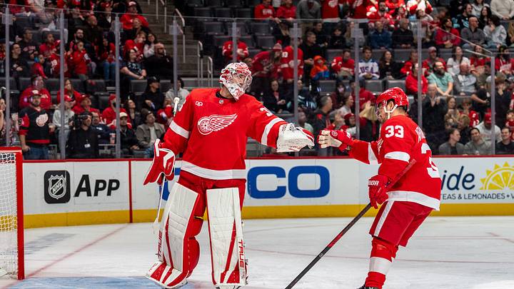 Oct 9, 2026; Detroit, Michigan, USA;  Detroit Red Wings goaltender John Gibson (36) celebrates a power play goal with left wing Viktor Arvidsson (33) in the first period against the Seattle Kraken at Little Caesars Arena.  Mandatory Credit: Paul Barnick-Imagn Images