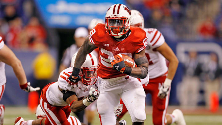 Montee Ball (28) scores a touchdown getting past Nebraska's Andrew Green (11) during the second half as the University of Wisconsin earned a 70-31 win over Nebraska in the 2012 Big Ten Championship football game at Lucas Oil Stadium in Indianapolis, Indiana on December 1, 2012.