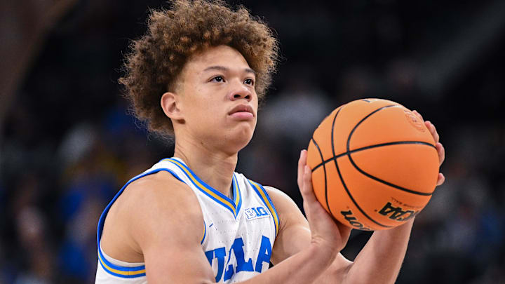 Dec 28, 2024; Inglewood, California, USA; UCLA Bruins guard Trent Perry (1) shoots a free throw during the first half against the Gonzaga Bulldogs at Intuit Dome. Mandatory Credit: Robert Hanashiro-Imagn Images