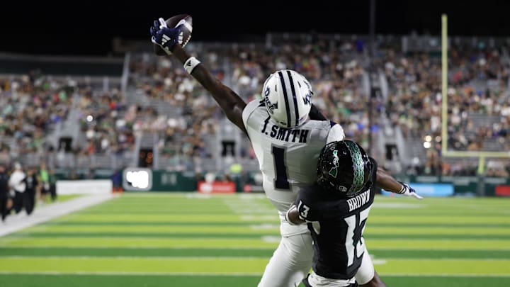 Oct 26, 2024; Honolulu, Hawaii, USA; While being guarded by Hawaii Rainbow Warriors defensive back Caleb Brown (13), Nevada Wolf Pack wide receiver Jaden Smith (1) can’t pull in a pass in the end zone during the fourth quarter at the Clarence T.C. Ching Athletics Complex. Mandatory Credit: Marco Garcia-Imagn Images
