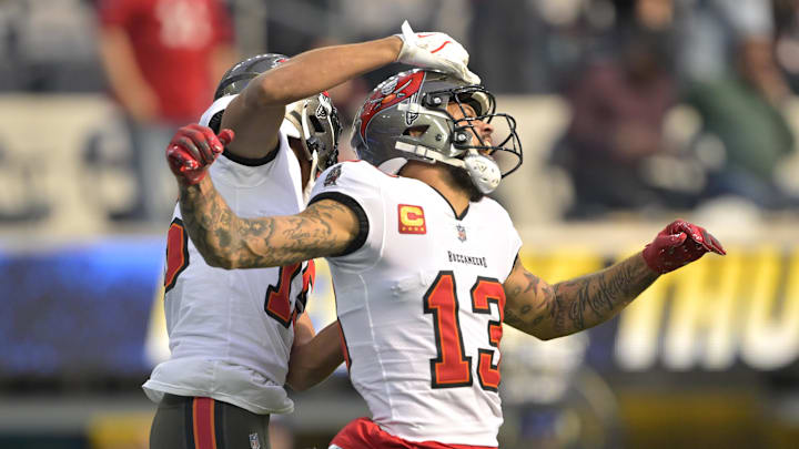 Dec 15, 2024; Inglewood, California, USA;  Tampa Bay Buccaneers wide receiver Mike Evans (13) celebrates with wide receiver Jalen McMillan (15) after a touchdown in the first half against the Los Angeles Chargers at SoFi Stadium. Mandatory Credit: Jayne Kamin-Oncea-Imagn Images