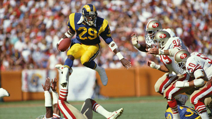 Sep 14, 1986; Anaheim, CA, USA; FILE PHOTO; Los Angeles Rams running back Eric Dickerson (29) carries the ball against the San Francisco 49ers at Anaheim Stadium. Mandatory Credit: Peter Brouillet-Imagn Images