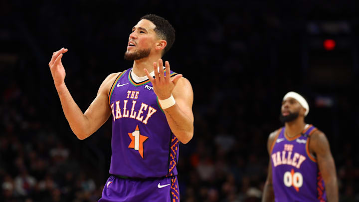 Phoenix Suns guard Devin Booker reacts against the Charlotte Hornets.