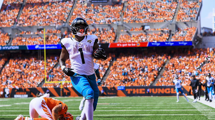 Sep 14, 2025; Cincinnati, Ohio, USA; Jacksonville Jaguars running back Travis Etienne Jr. (1) runs the ball in for a touchdown against the Cincinnati Bengals in the second half at Paycor Stadium. 