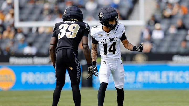 Apr 19, 2025; Boulder, CO, USA; Colorado Buffaloes wide receiver Quanell Farrakhan Jr. (14) and cornerback Ben Bouzi (39) during the spring game at Folsom Field. Mandatory Credit: Isaiah J. Downing-Imagn Images