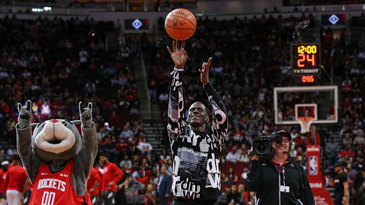 Feb 2, 2020; Houston, Texas, USA; Houston Rockets former player Vernon Maxwell shoots a ceremonial first shot before a game between the Houston Rockets and the New Orleans Pelicans at Toyota Center. Mandatory Credit: Troy Taormina-Imagn Images