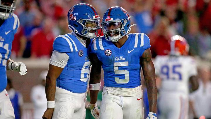 Mississippi Rebels quarterback Trinidad Chambliss reacts with running back Kewan Lacy after a touchdown run during the first quarter against the Florida Gators at Vaught-Hemingway Stadium. Mississippi Rebels quarterback Trinidad Chambliss reacts with running back Kewan Lacy after a touchdown run during the first quarter against the Florida Gators at Vaught-Hemingway Stadium.