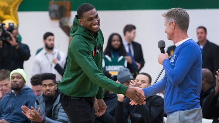 Golden State Warrior center Kevon Looney (left) is introduced by his current head coach, Steve Kerr,while taking part in a ceremony where his jersey is retired  Thursday, December 6, 2018 at Hamilton High School.

Mjs Looney 1 Hoffman 75306420