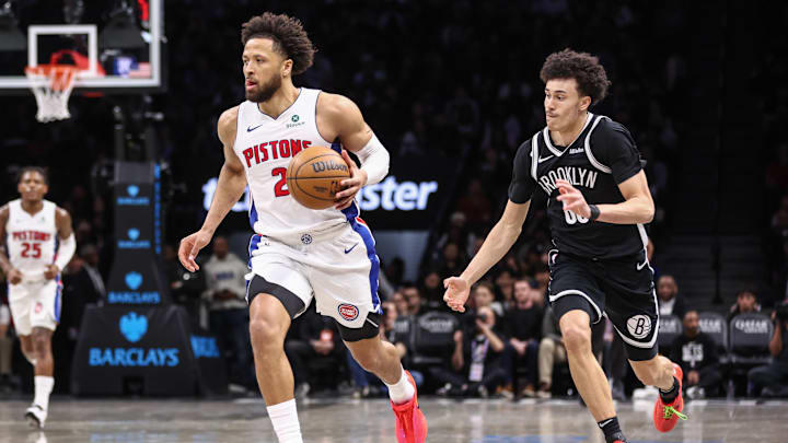 Mar 10, 2026; Brooklyn, New York, USA;  Detroit Pistons guard Cade Cunningham (2) drives past Brooklyn Nets guard Nolan Traore (88) in the third quarter at Barclays Center. Mandatory Credit: Wendell Cruz-Imagn Images