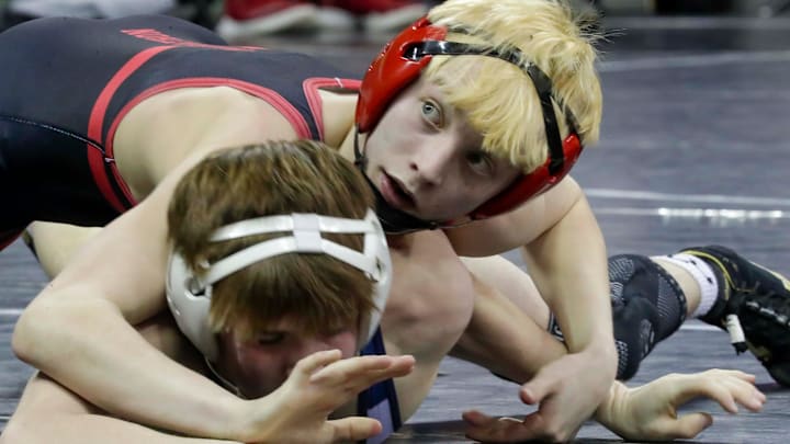 Marathon's Blake Underwood, top, grips Markesan’s Gavin Slark during a 113-pound match during the WIAA Division 3 state individual wrestling tournament on February 28, 2025.