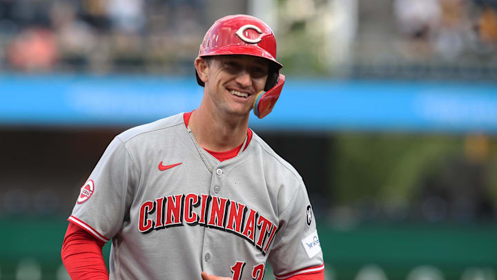May 19, 2025; Pittsburgh, Pennsylvania, USA;  Cincinnati Reds left fielder Austin Hays (12) reacts after hitting an RBI double against the Pittsburgh Pirates during the first inning at PNC Park. Mandatory Credit: Charles LeClaire-Imagn Images