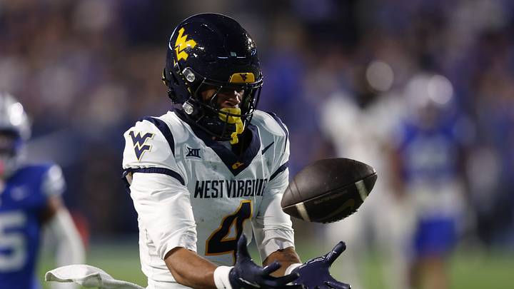 Oct 3, 2025; Provo, Utah, USA; West Virginia Mountaineers wide receiver Cam Vaughn (4) tips a catch against the Brigham Young Cougars during the third quarter at LaVell Edwards Stadium. Mandatory Credit: Rob Gray-Imagn Images Oct 3, 2025; Provo, Utah, USA; West Virginia Mountaineers wide receiver Cam Vaughn (4) tips a catch against the Brigham Young Cougars during the third quarter at LaVell Edwards Stadium. Mandatory Credit: Rob Gray-Imagn Images