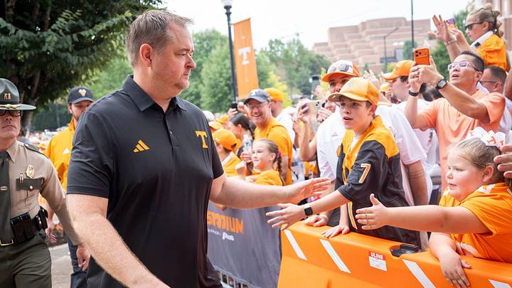 Tennessee coach Josh Heupel high fives fans during a modified Vol Walk before Tennessee’s game against Furman on Sept. 5, 2026.