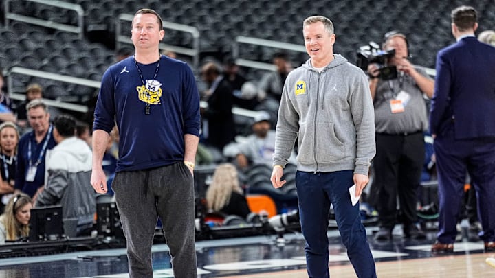 Michigan head coach Dusty May and assistant coach and general manager Kyle Church watch open practice at Lucas Oil Stadium in Indianapolis on Friday, April 3, 2026.