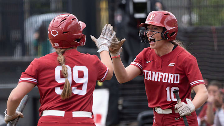 Stanford’s Taryn Kern, left, celebrates the first score of the fame with teammate 	Jade Berry during first inning of the Eugene NCAA Softball Regional May 17, 2025.