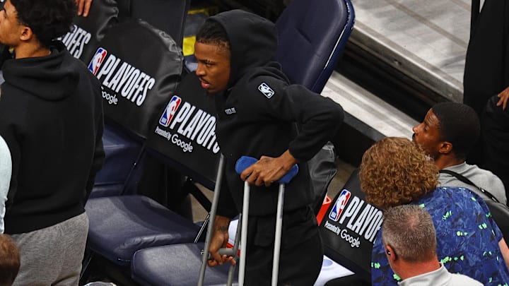 Apr 24, 2025; Memphis, Tennessee, USA; Memphis Grizzlies guard Ja Morant (12) stands by the bench on crutches during the fourth quarter against the Oklahoma City Thunder during game three for the first round of the 2024 NBA Playoffs at FedExForum. Mandatory Credit: Petre Thomas-Imagn Images Apr 24, 2025; Memphis, Tennessee, USA; Memphis Grizzlies guard Ja Morant (12) stands by the bench on crutches during the fourth quarter against the Oklahoma City Thunder during game three for the first round of the 2024 NBA Playoffs at FedExForum. Mandatory Credit: Petre Thomas-Imagn Images