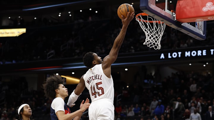 Dec 12, 2025; Washington, District of Columbia, USA; Cleveland Cavaliers guard Donovan Mitchell (45) shoots the ball as Washington Wizards forward Kyshawn George (18) chases in the fourth quarter at Capital One Arena. Mandatory Credit: Geoff Burke-Imagn Images Dec 12, 2025; Washington, District of Columbia, USA; Cleveland Cavaliers guard Donovan Mitchell (45) shoots the ball as Washington Wizards forward Kyshawn George (18) chases in the fourth quarter at Capital One Arena. Mandatory Credit: Geoff Burke-Imagn Images